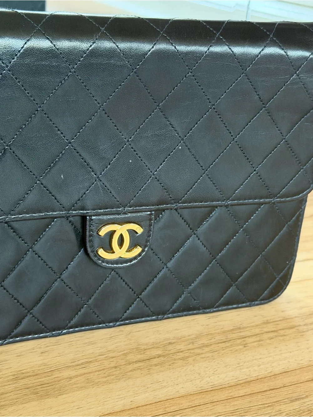 CHANEL Black Quilted Lambskin monoflap with Gold CC Emblem